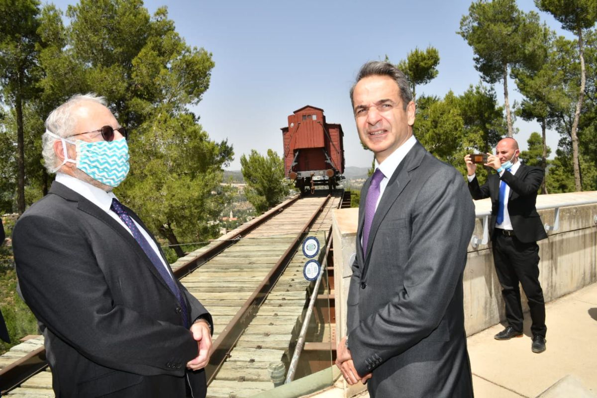Yad Vashem Senior Historian Dr. Robert Rozett guiding the Greek Prime Minister in front of the Cattle Car – the Memorial to the Deportees located on Yad Vashem's Mount of Remembrance.